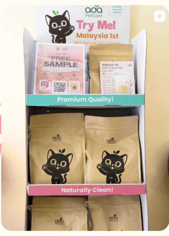 ADA Pet Care tofu cat litter on a retail display stand with free sample packs